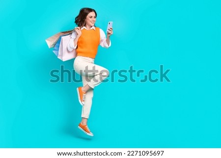 Full body size photo of business lady hold phone enjoy online shopping black friday hold packages amazon offer isolated on cyan color background