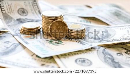 Dollar bills laid out on table. Three different columns of coins, 20 cents coin, financial crisis, money, finance, savings, salary, bank, euro cents. Photo, macro photography
