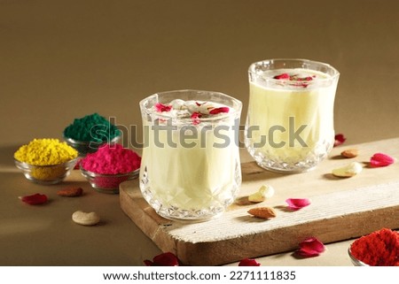 Indian festival Holi concept - Traditional Indian beverage Thandai Sardai milk festival food, with nuts and color in bowl. Royalty-Free Stock Photo #2271111835