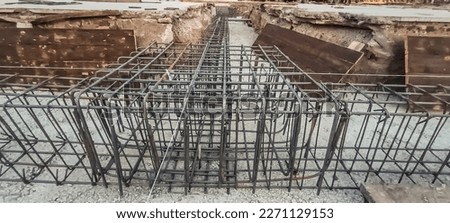 Construction site. The timber formwork is prepared for pouring concrete. The metal fittings are also visible. The process of building a private house Royalty-Free Stock Photo #2271129153