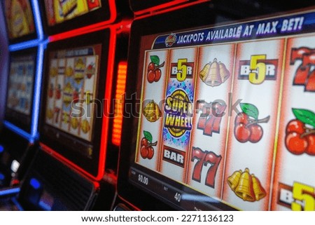 Slot machine or commonly called a one arm bandit is a gambling machine that creates a game of chance for its customers. Royalty-Free Stock Photo #2271136123