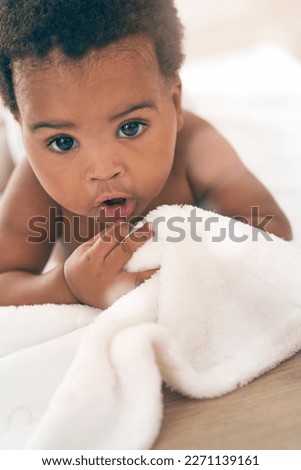Cute baby, black child and crawling on blanket for play, fun and relax in nursery room. Adorable young african infant kids, girl and face of healthy development, growth and learning to crawl in house