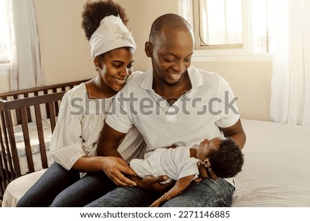 Parents together holding a new born. Family concept. Royalty-Free Stock Photo #2271146885