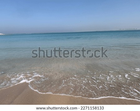 Calm sea shore blue and sand