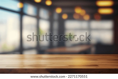 Wooden empty table in front, blurred cafe background. Bar counter key visual. Wood table top for presentation product. Restaurant table mockup. Cafe desk effect. Coworking office space interior