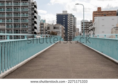 cross an empty bridge in the city Royalty-Free Stock Photo #2271171333