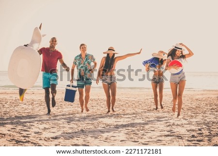 Group of friends having fun on the beach - Young and happy tourists bonding outdoors, enjoying summertime