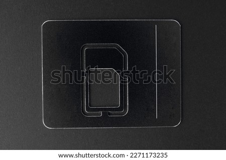 Empty sim card holder close up on a black background