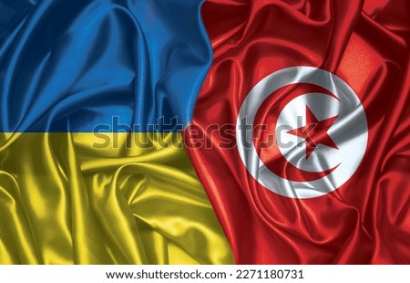 Ukraine and Tunisia folded silk flag together