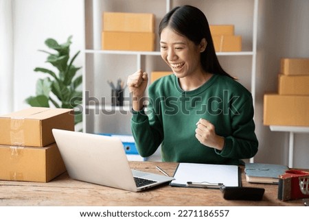 Entrepreneurs Small Business SME, Young Asian women happy after a new order from the customer, business owner working at home office, online shopping SME entrepreneur or freelance working concept.