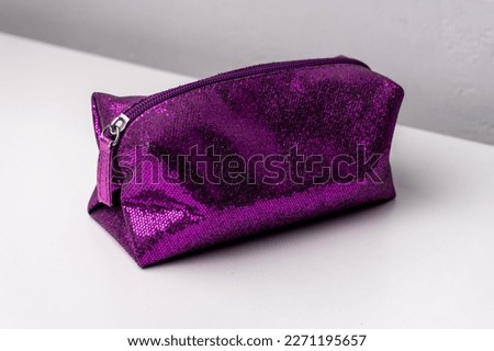 Glitter makeup bag isolated on white background Royalty-Free Stock Photo #2271195657