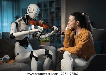 A pretty young girl listens to a piece of classical music played flawlessly by her I.A.-equipped Robot. Royalty-Free Stock Photo #2271198509