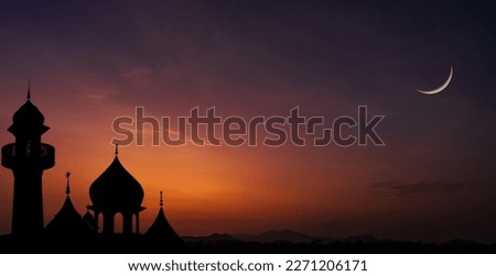 Islamic, Silhouette mosques on dusk sky twilight with crescent moon over mountain, religion of Islam and free space for text Ramadan Kareem, Eid Al Fitr, Eid Al Adha, Eid Mubarak, Muharram, Maulid