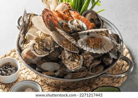 Korean food dish Assorted Seafood Steamed Clams Royalty-Free Stock Photo #2271217443