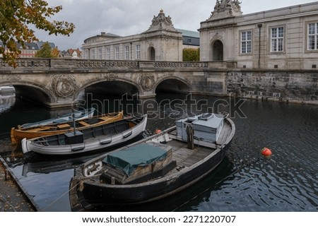 Top view group of small boats docks on the canal in Copenhagen, Denmark in autumn season.