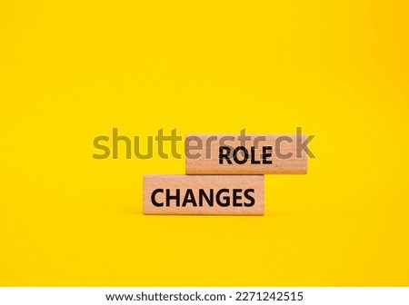 Role changes symbol. Concept words Role changes on wooden blocks. Beautiful yellow background. Business and Role changes concept. Copy space.