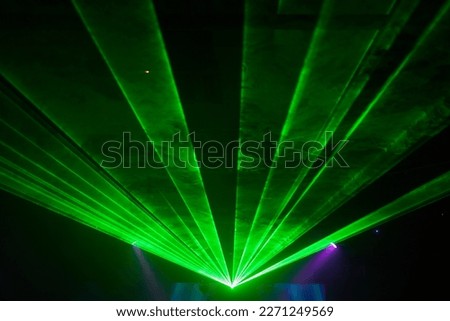 Bright red neon laser lights illuminate the darkness creating lines and triangle shapes in sci-fi effect