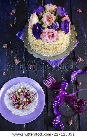 cake with almonds and poppy seeds on a dark wood background