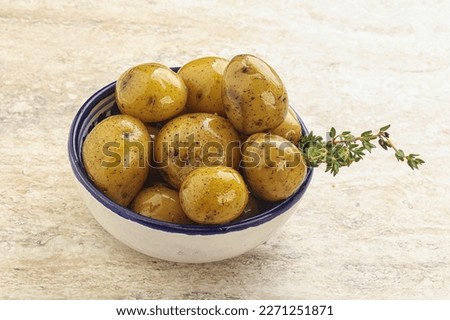 Boiled baby potato with oil in the bowl