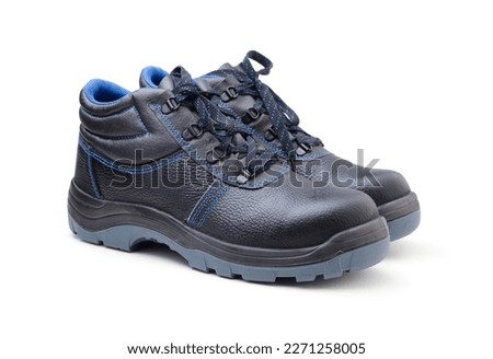 Pair of new work boots isolated on white. Royalty-Free Stock Photo #2271258005