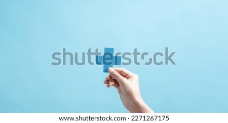 Health insurance concept. people hands holding plus and healthcare medical icon, health and access to welfare health concept. Royalty-Free Stock Photo #2271267175