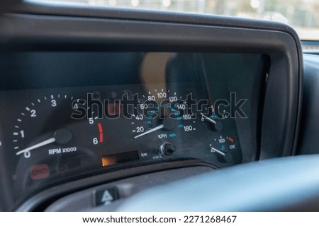 Car dashboard detail view with speedometer