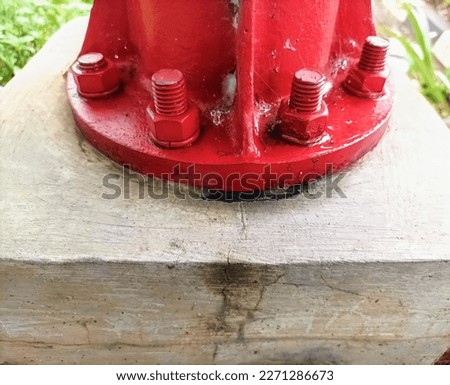 Closeup detail of nuts and screws on hydrant poles after repainting for maintenance to prevent rust and corrosion. Royalty-Free Stock Photo #2271286673