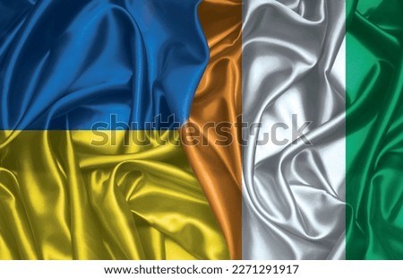 Ukraine and Cote d Ivoire flag folded silk flag together