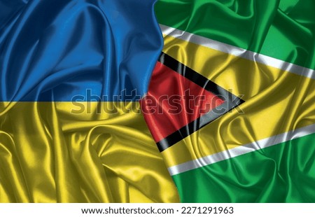Ukraine and Guyana folded silk flag together
