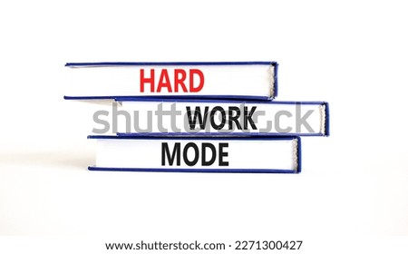 Hard work mode symbol. Concept words Hard work mode on books on a beautiful white table white background. Business and Hard work mode concept. Copy space.