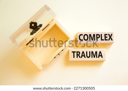 Complex trauma symbol. Concept words Complex trauma on wooden block. Beautiful white table white background. Empthy opened wooden chest. Business psychology complex trauma concept. Copy space.
