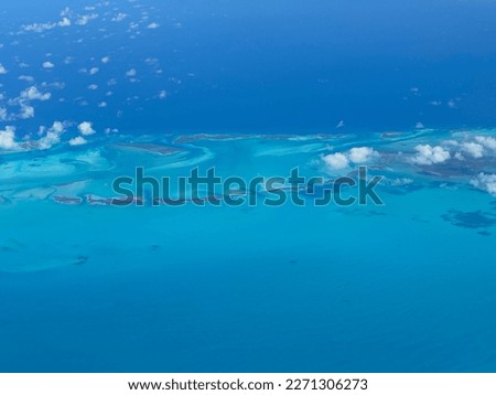 Beautiful view of Bahamas islands from above. Immense blue aerial landscape