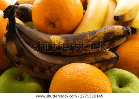fruits taken close-up lie for a long time and deteriorate from time to time, darkened blackened bananas Royalty-Free Stock Photo #2271310145