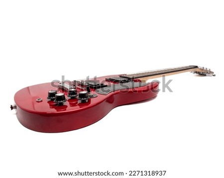 Red electric guitar isolated on white background. Musical instrument guitar. Close-up. Royalty-Free Stock Photo #2271318937