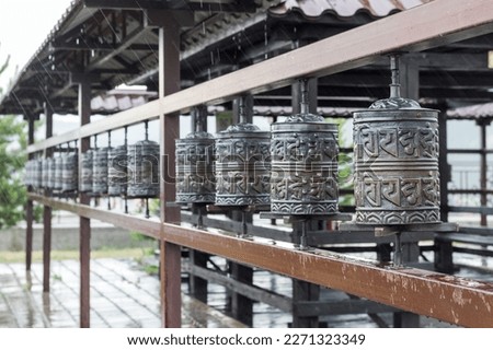 Religious prayer wheel for meditation in a Buddhist temple in Buryatia, Russia Ulan-Ude. Royalty-Free Stock Photo #2271323349