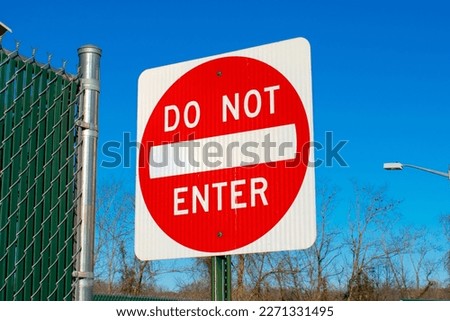 Do not enter street sign against a blue sky background