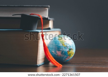 Graduation cap with Earth globe. Concept of global business study, abroad educational, Back to School. Education in Global world, Study abroad business in universities in worldwide. language study Royalty-Free Stock Photo #2271361507