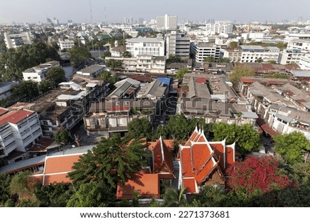 In front of the monastery Wat Saket, temple roofs and old quarter, view from Golden Mountain, district Pom Prap Sattru Phai, Bangkok, Thailand Royalty-Free Stock Photo #2271373681