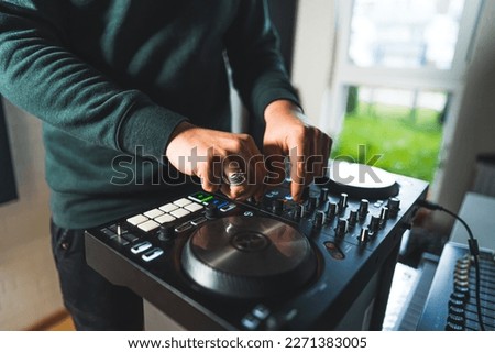 closeup shot of a man working on a sound mixer device, music concept. High quality photo