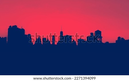 New York City skyline buildings form silhouette shapes against the background sky in Manhattan with red and blue colors Royalty-Free Stock Photo #2271394099