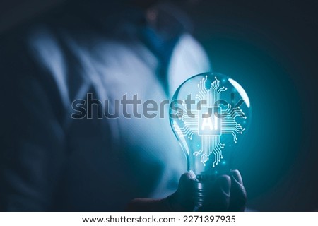 hand holding a light bulb. artificial intelligence or AI of future innovation technology concept, applying technology to business in the digital age. empowering global business AI.