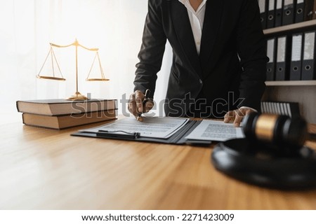 Female lawyer, legal consultant, asian businesswoman checking documents before signing venture capital business finance legal services concept in office. Royalty-Free Stock Photo #2271423009