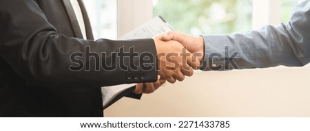 Close up hand of young couple new landlord, tenant or rental handshake with home, apartment agent or realtor woman after bank approved mortgage, loan signed purchase contract. Property of financial.