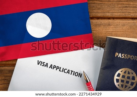 Visa application form, passport and flag of Laos 