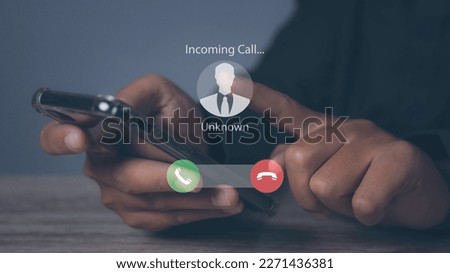 Man answering to incoming from an unknown caller. Phone call from unknown number. Calling Incoming Communication Connect Concept. Royalty-Free Stock Photo #2271436381