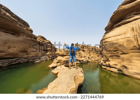 Adventurous man is standing on Grand Canyon of Mekhong river and enjoying the beautiful view. Beautiful Nature Thailand natural landscape photography