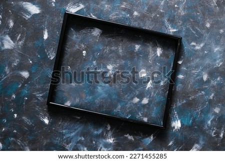 black rectangular picture frame mock-up with copy space for yout text or image on top of hand painted background in blue and white style