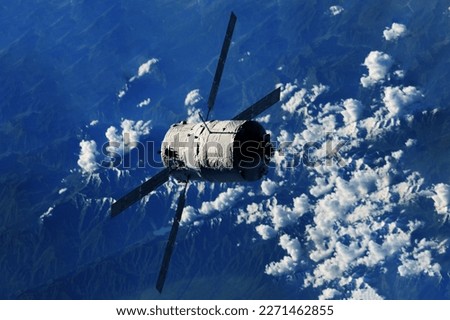 Spaceship over the planet in space. Elements of this image furnishing NASA. High quality photo