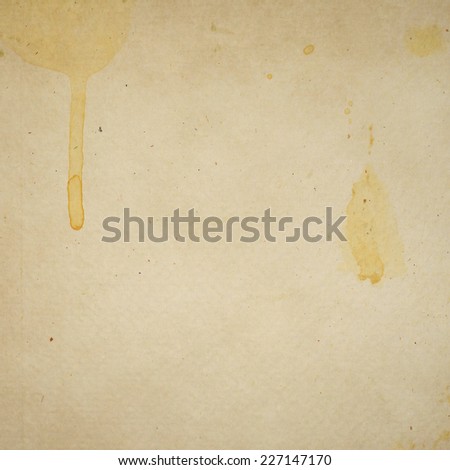 old paper texture or background with yellow watercolor spatters