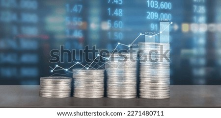 Stack of coin with trading graph, financial investment concept